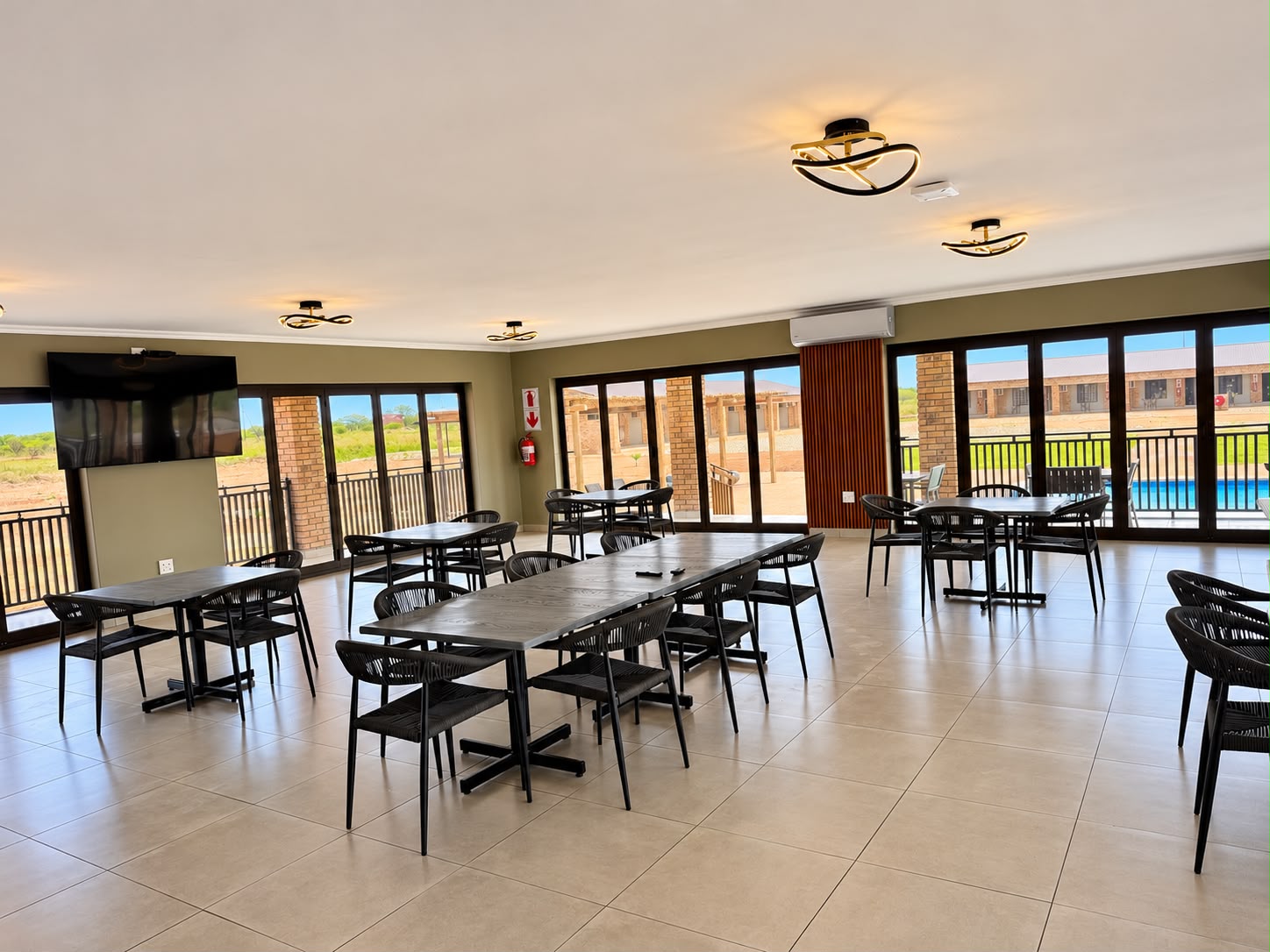 Vaulted brick dining hall with long communal table
